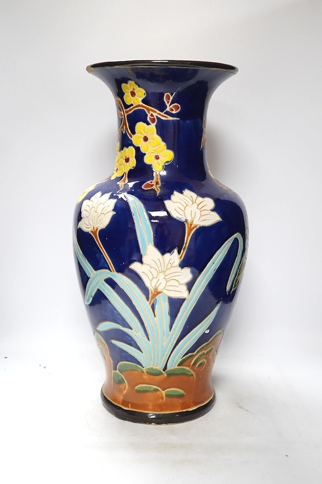 A South East Asian polychrome pottery vase and a Staffordshire pottery greyhound pen holder, vase 53cm high. Condition - vase fair, pen holder marks to glazing